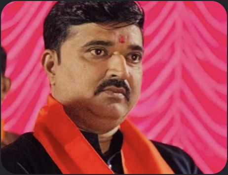 Hardik Tamaliya in saffron scarf