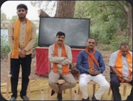 Hardik Tamaliya with local workers outdoors
